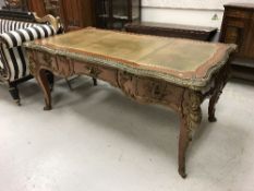 A kingwood and gilt bronze / brass embellished bureau plat in the Louis XV taste,