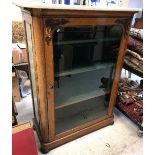A Victorian satin walnut display cabinet with grey veined white marble top over a single glazed