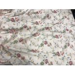 A pair of silk cream ground multi-coloured floral decorated interlined curtains with taped pencil