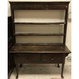A 19th Century oak dresser, the plain top with moulded edge over two frieze drawers,