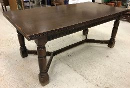 A modern oak draw leaf dining table in the 17th Century style,