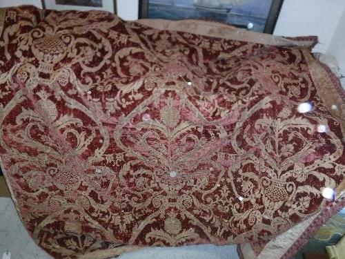 A 19th Century velvet red and gold tablecloth with tasselled edge and bird and foliate decoration