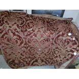 A 19th Century velvet red and gold tablecloth with tasselled edge and bird and foliate decoration