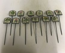 A set of twelve modern cast metal painted herb signs inscribed "Lavender", "Parsley", "Thyme",