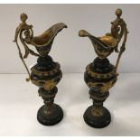 A pair of 19th Century French bronze and gilt bronze ornamental ewers in the Classical taste, 39.