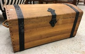 A modern teak dome top trunk as a treasure chest,