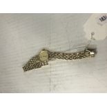 A ladies Accurist "gold" dress watch with 9 carat gold fancy chainlink bracelet, approx.