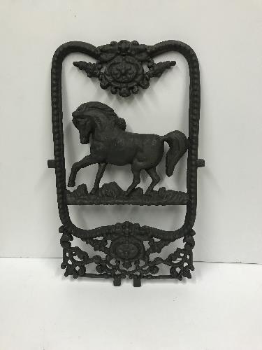 A modern cast iron stable window with horse decoration