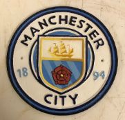 A modern painted cast metal sign "Manchester City",