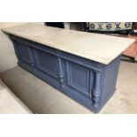 A Victorian painted pine shop counter, the front with column and panel decoration,