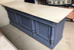 A Victorian painted pine shop counter, the front with column and panel decoration,