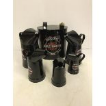 A set of five modern painted oil cans and an oval modern painted petrol can "Harley Davidson",
