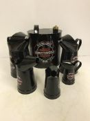 A set of five modern painted oil cans and an oval modern painted petrol can "Harley Davidson",