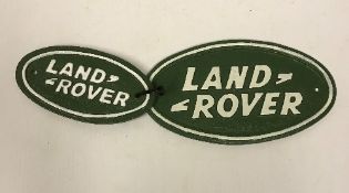 Two modern painted cast iron signs inscribed "Landrover",