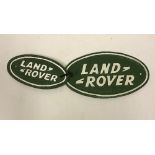 Two modern painted cast iron signs inscribed "Landrover",