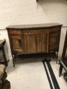 An Edwardian rosewood and inlaid side cabinet of canted form,