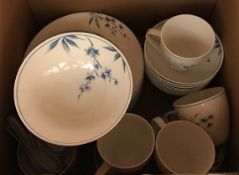 A box containing an Interiors Oriental Floral china part dinner set,