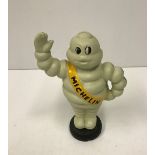 A modern painted cast iron Michelin figure,