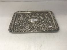 An Edwardian embossed silver rectangular tray with all over scrolling foliate and floral decoration