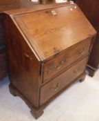 An 18th Century elm bureau the sloping f