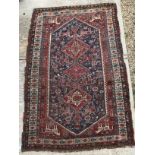 A fine Qashqai tribal rug with three rep