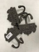 Three modern painted cast iron robe hooks inscribed "GWR"