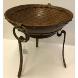 A modern cast iron fire pit on stand, 41.