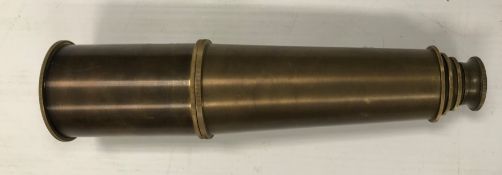 A modern reproduction brass four draw te