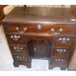 A George III mahogany kneehole desk, the