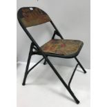 A painted metal folding chair inscribed "Billie Smart's Circus Britain's Greatest"