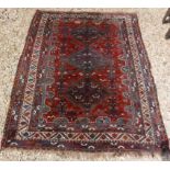 A Shiraz tribal carpet with three repeat