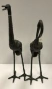 Two modern verdigris patinated bronze crane figures