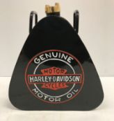 A modern painted metal triangular fuel can inscribed "Harley Davidson Motorcycles Genuine Motor