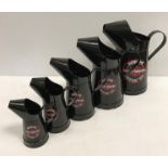 A set of five modern graduated painted metal oil cans bearing labels "Harley Davidson Motocycles