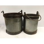 Two large galvanised and studded steel swing handled buckets