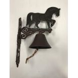 A painted cast metal "Heavy Horse" bell