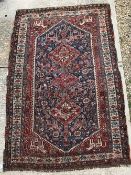 A fine Qashqai tribal rug with three rep