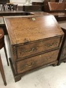 An 18th Century elm bureau the sloping f