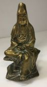 A Chinese bronze figure of Guan Yin seat