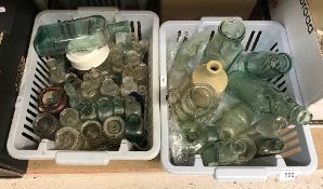 A large collection of assorted vintage glass bottles to include lemonade bottles, ink bottles, etc,