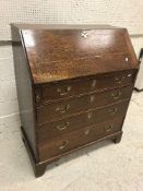 A 19th Century oak bureau, the plain top