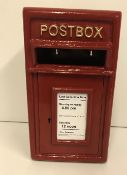 A modern red post box, 43.5 cm high