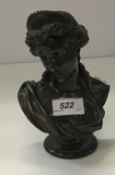 A patinated bronze bust of a classical m