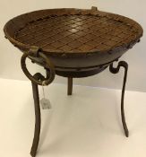 A modern cast iron fire pit on stand, 41.