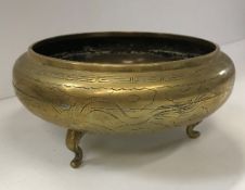 A Chinese bronze bowl with engraved drag