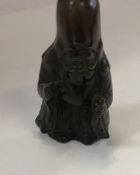 A Japanese bronze figure of Fukurokuju,