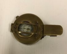 A modern reproduction brass marching compass
