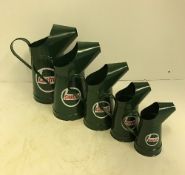 A set of five modern painted metal oil type cans "Castrol", smallest 20 cm high,