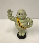 A modern painted cast iron Michelin figure,