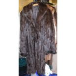 A full length brown mink coat, together